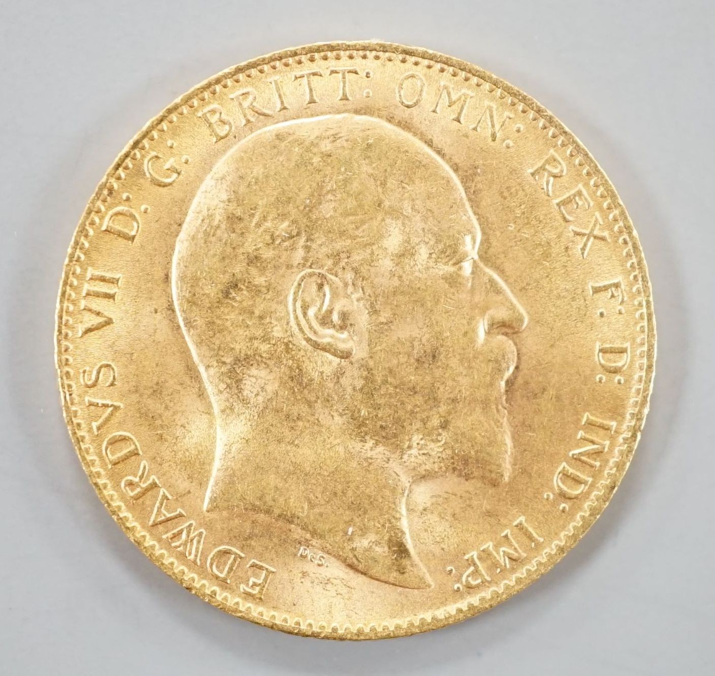 An Edward VII 1904 gold sovereign.